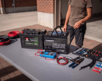Image of a work table with a lithium battery and a leisure battery